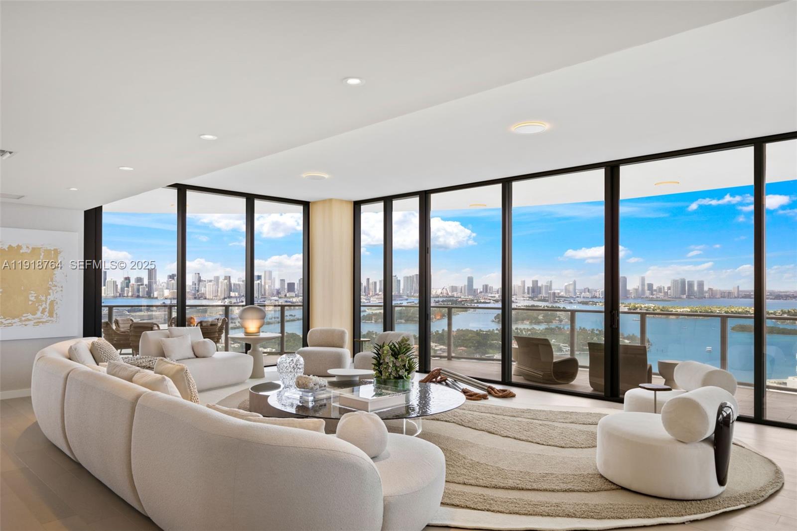 500 Alton Road, Unit 3402 03 Miami Beach, FL 33139 - Photo 1 of 77 a living room with furniture and a large window