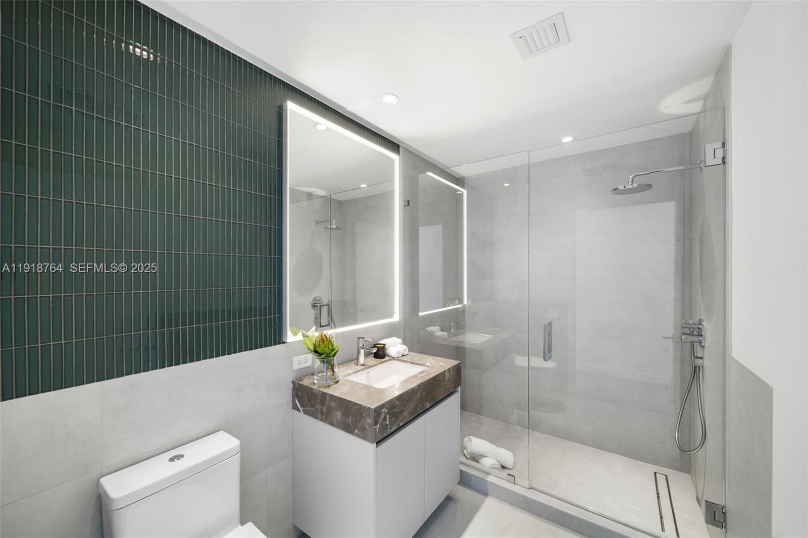 500 Alton Road, Unit 3402 03 Miami Beach, FL 33139 - Photo 20 of 77 a bathroom with a sink a toilet and shower