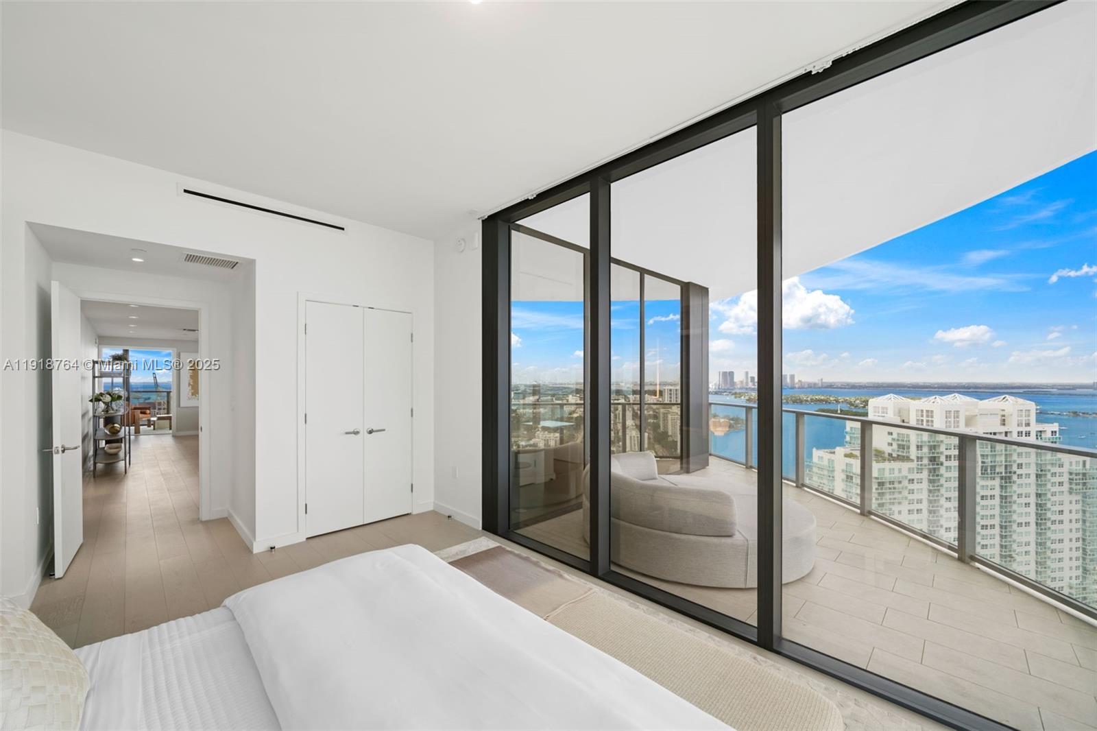 500 Alton Road, Unit 3402 03 Miami Beach, FL 33139 - Photo 24 of 77 a bedroom with furniture and large window