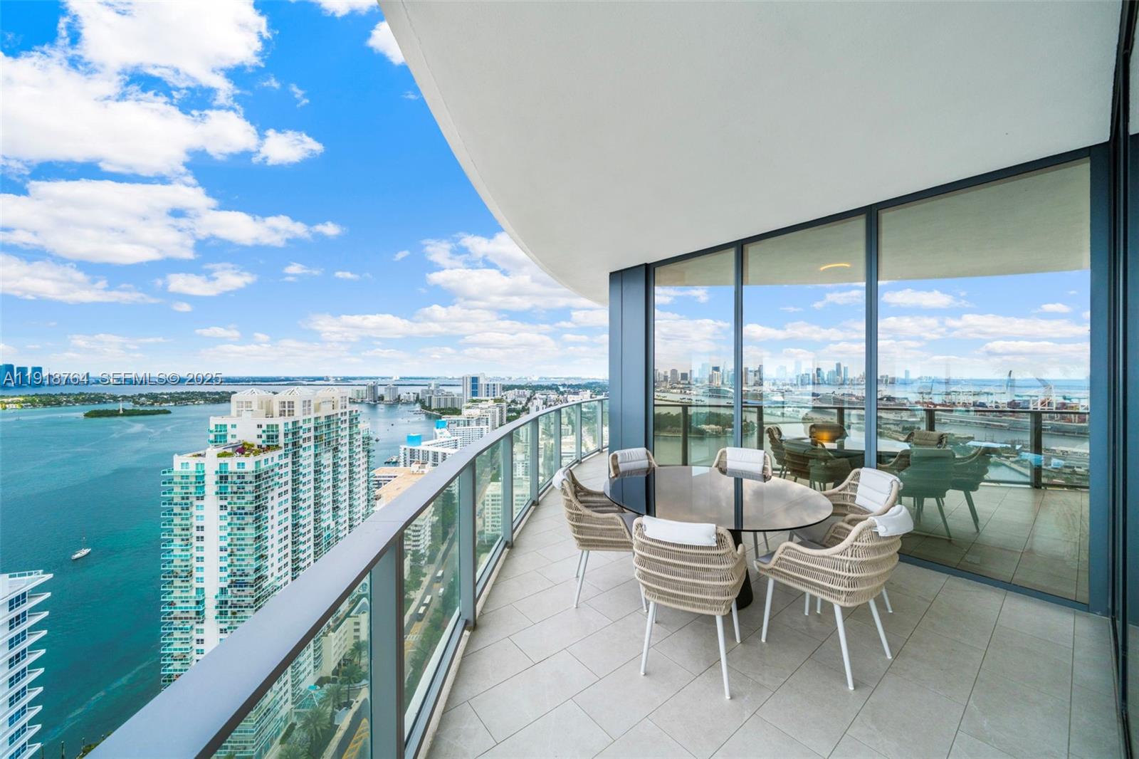 500 Alton Road, Unit 3402 03 Miami Beach, FL 33139 - Photo 32 of 77 a balcony with furniture and city view