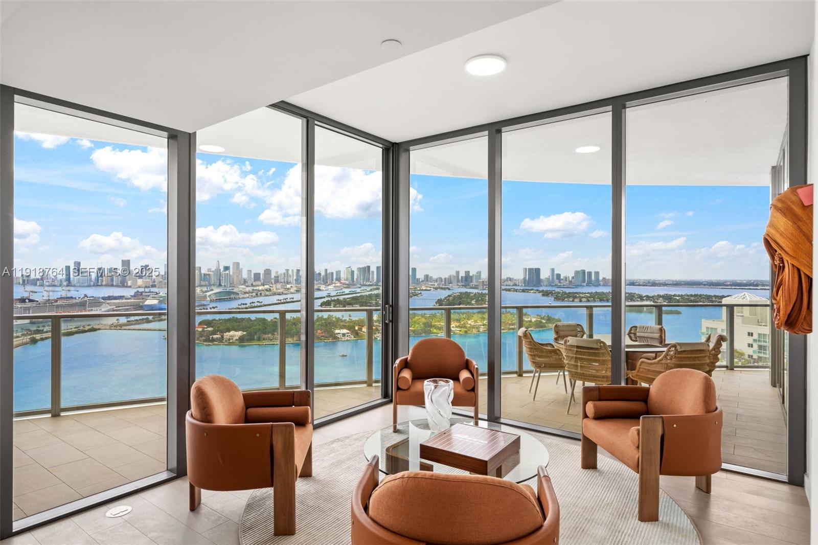 500 Alton Road, Unit 3402 03 Miami Beach, FL 33139 - Photo 37 of 77 a living room with furniture and a floor to ceiling window