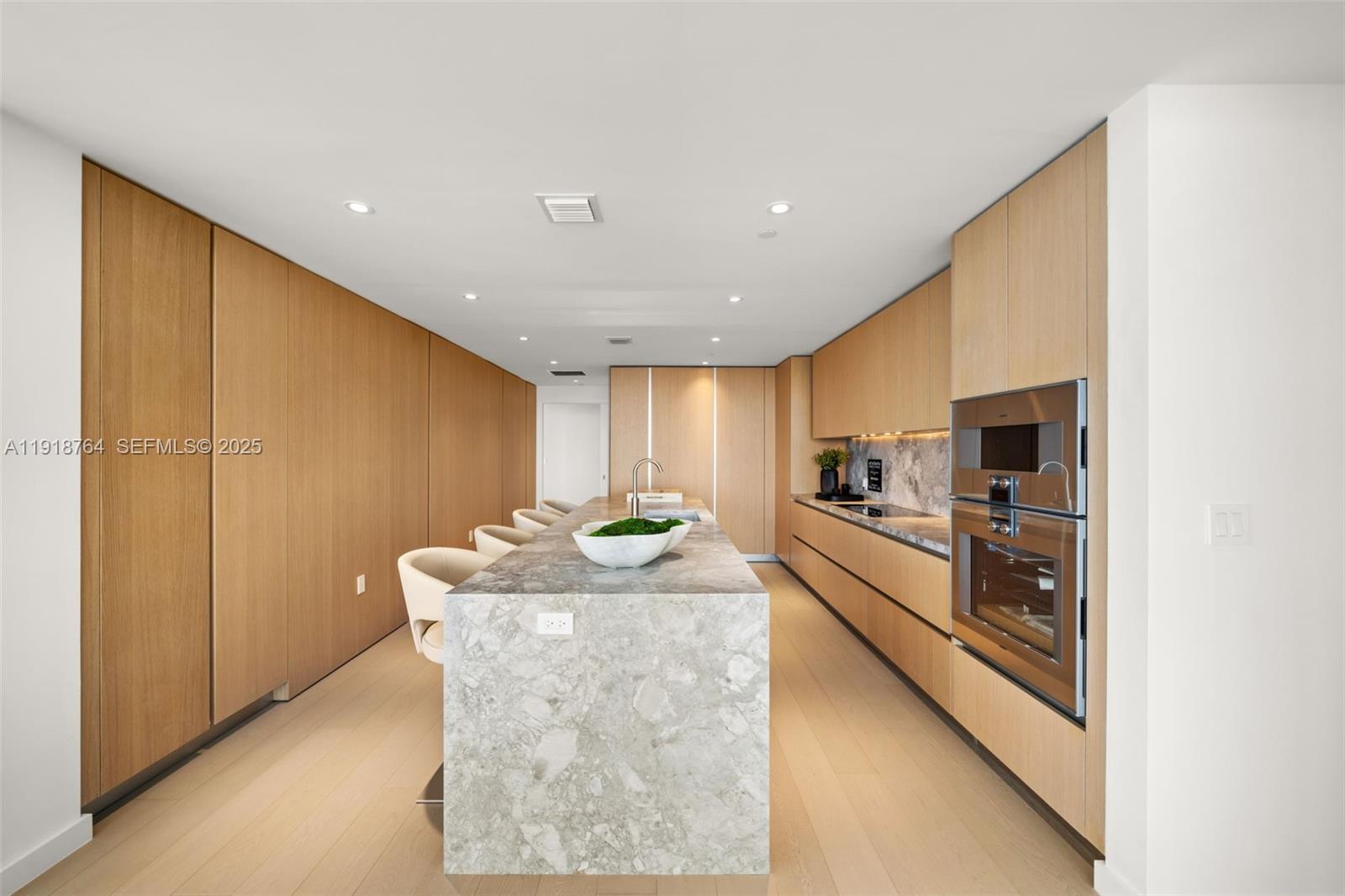 500 Alton Road, Unit 3402 03 Miami Beach, FL 33139 - Photo 41 of 77 a large kitchen with stainless steel appliances granite countertop a stove and a refrigerator