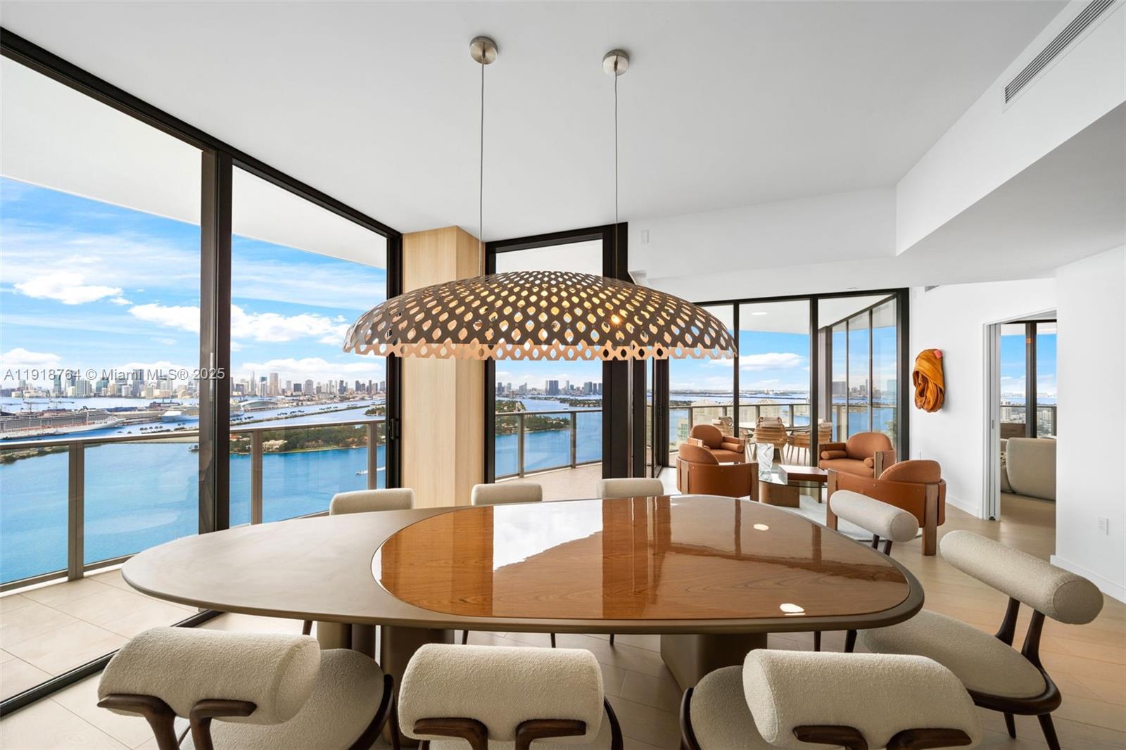 500 Alton Road, Unit 3402 03 Miami Beach, FL 33139 - Photo 46 of 77 a dining room with furniture a chandelier and wooden floor