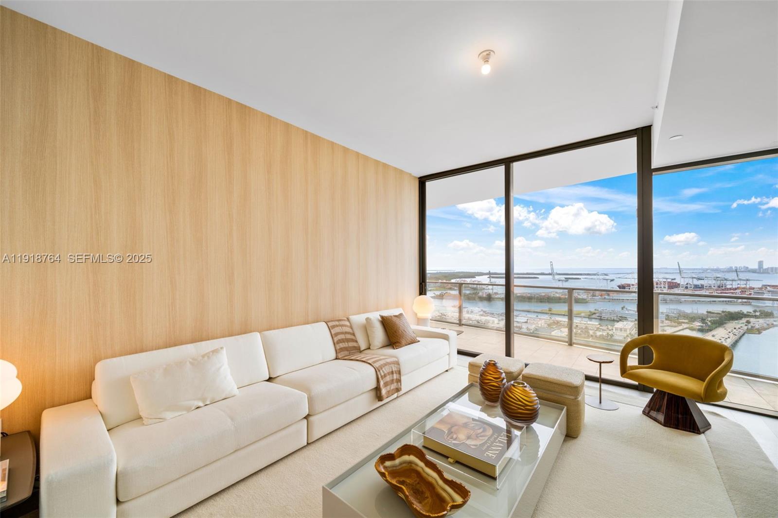 500 Alton Road, Unit 3402 03 Miami Beach, FL 33139 - Photo 48 of 77 a living room with furniture and floor to ceiling window