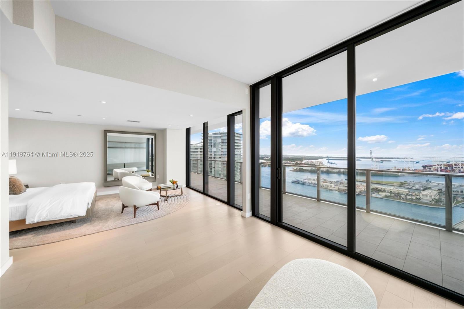 500 Alton Road, Unit 3402 03 Miami Beach, FL 33139 - Photo 53 of 77 a living room with furniture and a floor to ceiling window