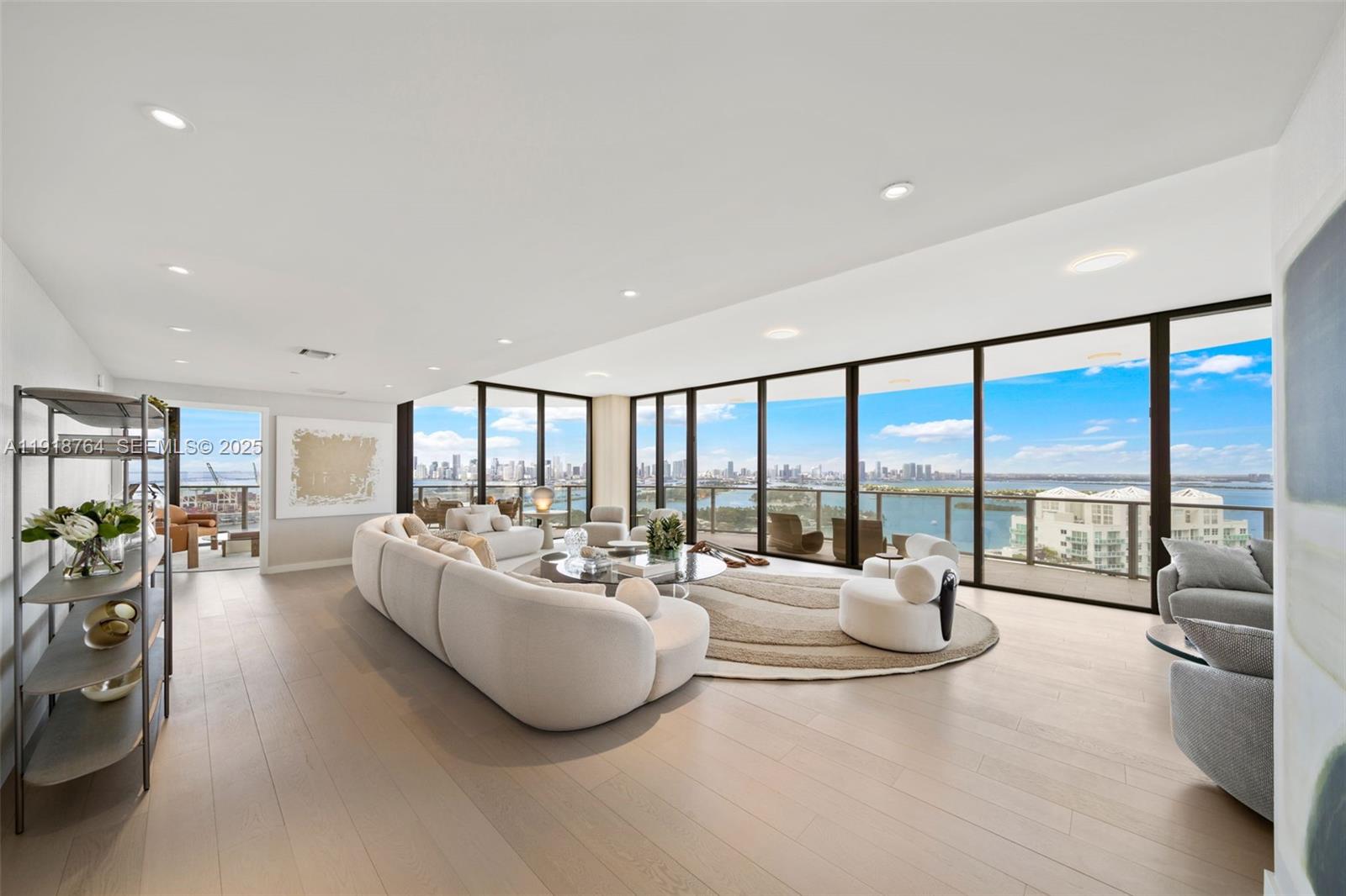 500 Alton Road, Unit 3402 03 Miami Beach, FL 33139 - Photo 6 of 77 a living room with furniture and a large window