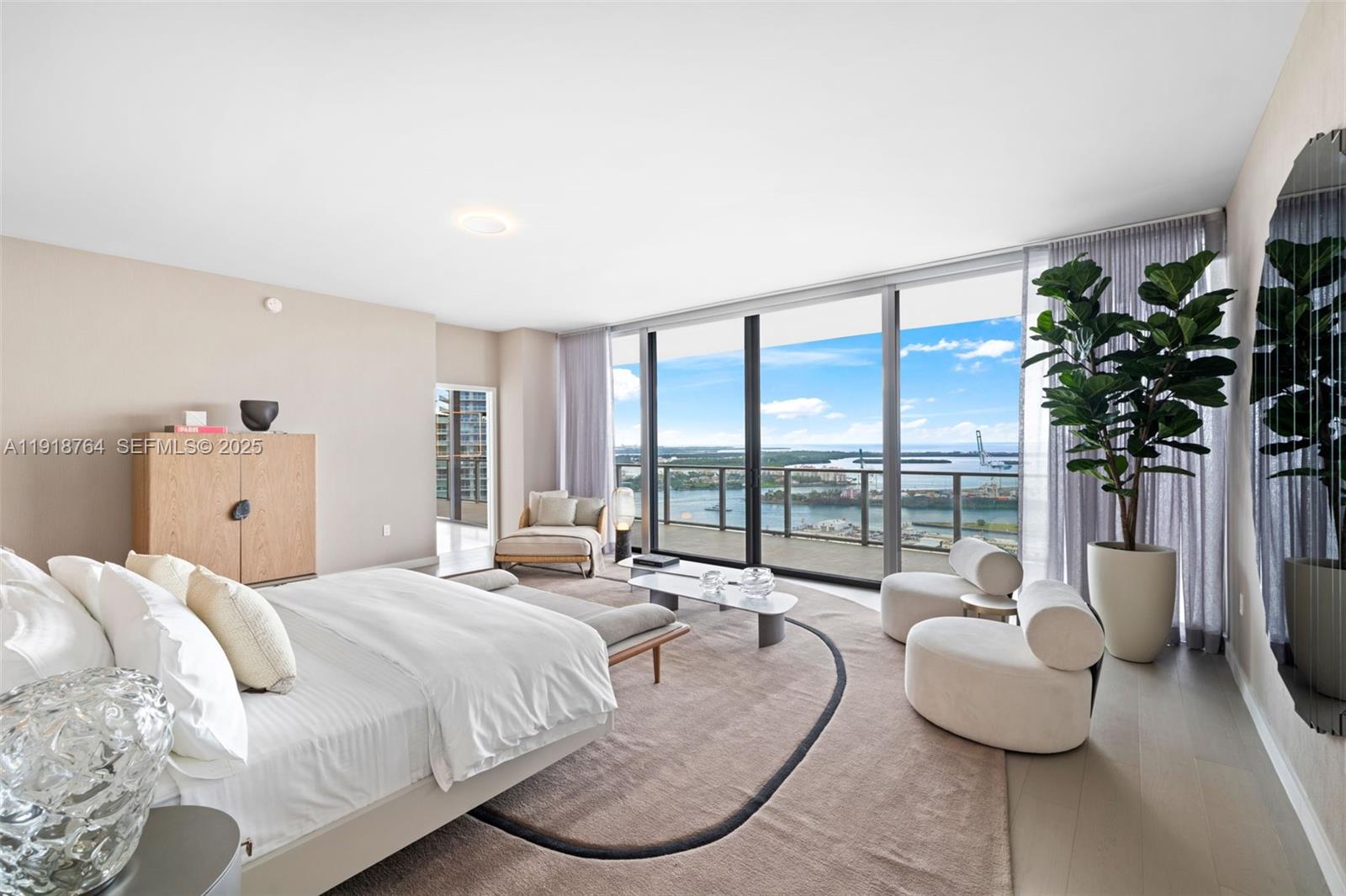 500 Alton Road, Unit 3402 03 Miami Beach, FL 33139 - Photo 62 of 77 a spacious bedroom with a bed and a large window