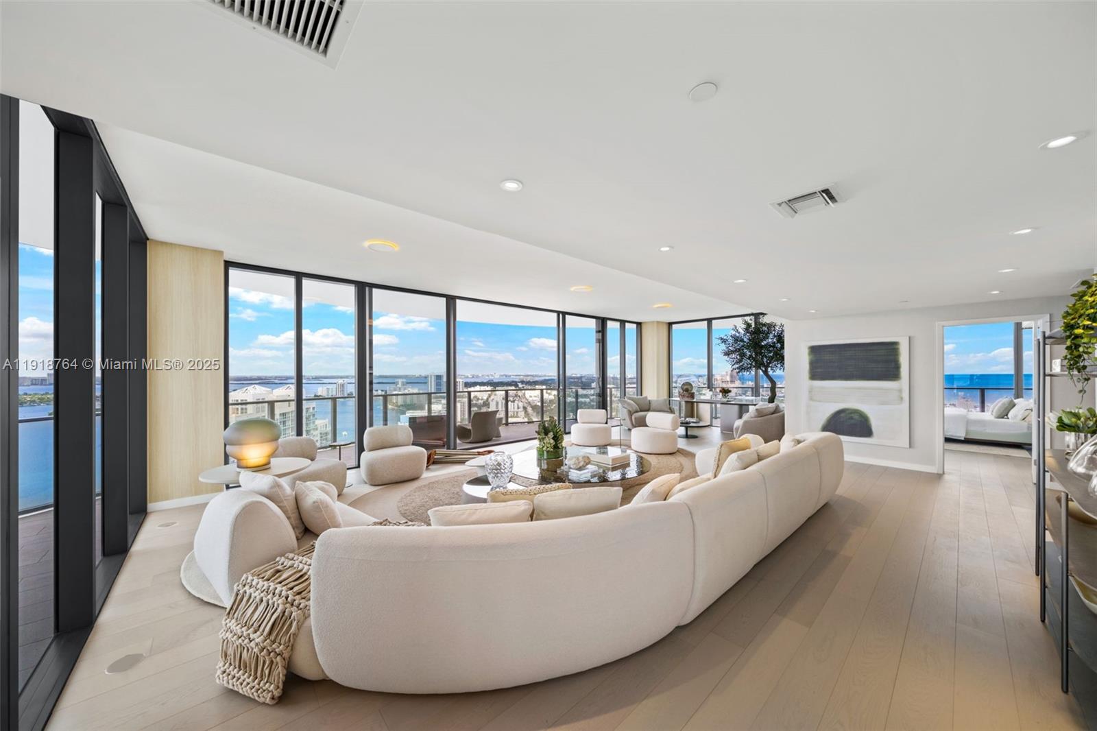 500 Alton Road, Unit 3402 03 Miami Beach, FL 33139 - Photo 7 of 77 a living room with furniture and a large window
