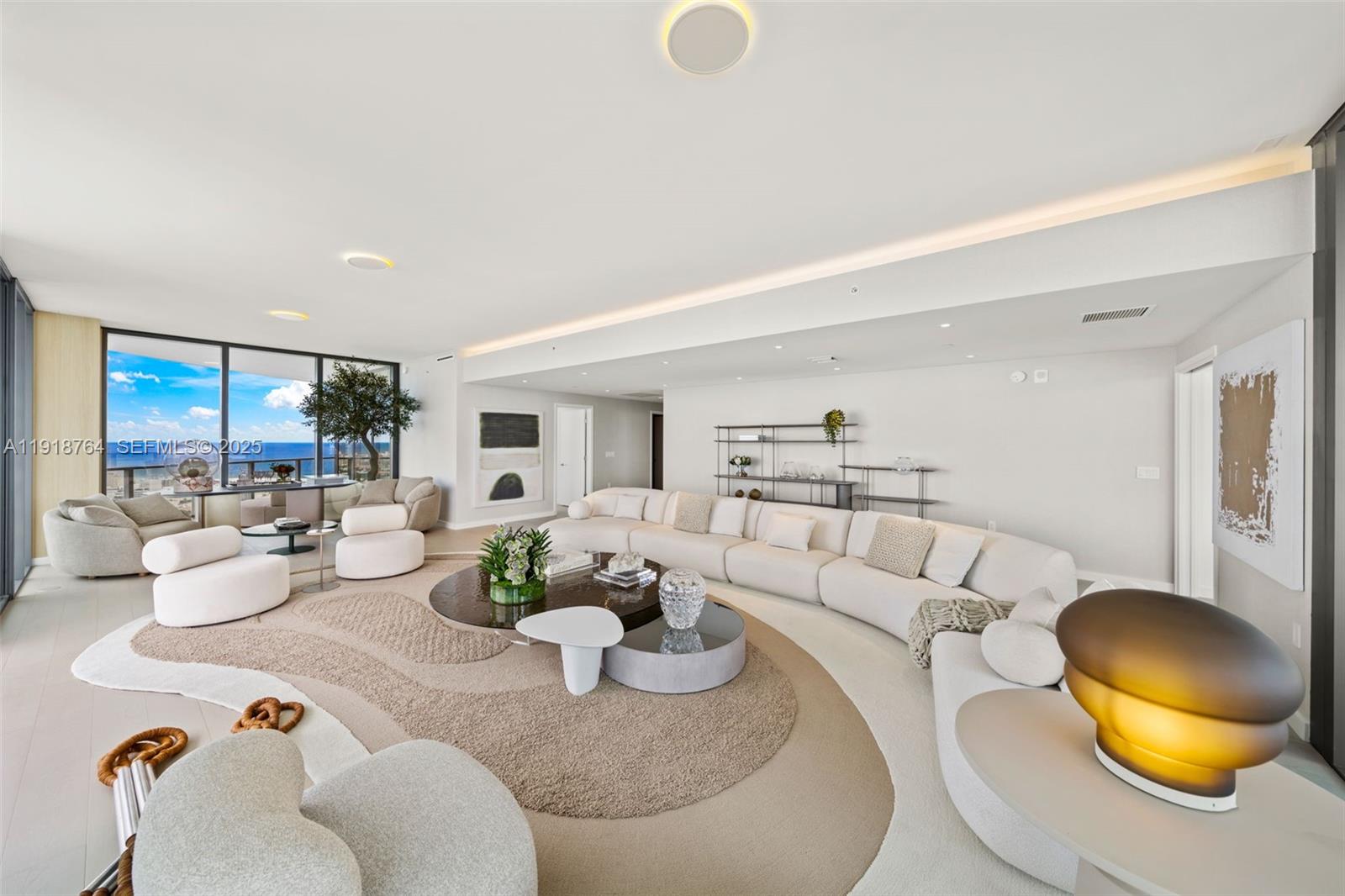 500 Alton Road, Unit 3402 03 Miami Beach, FL 33139 - Photo 9 of 77 a living room with furniture and a table