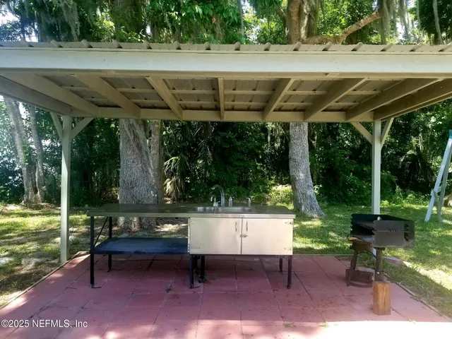 a view of a lake with a palm tree