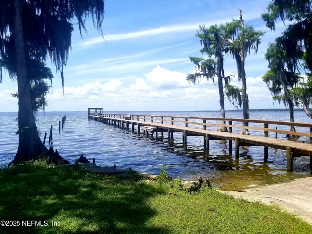 a view of a swimming pool with a patio