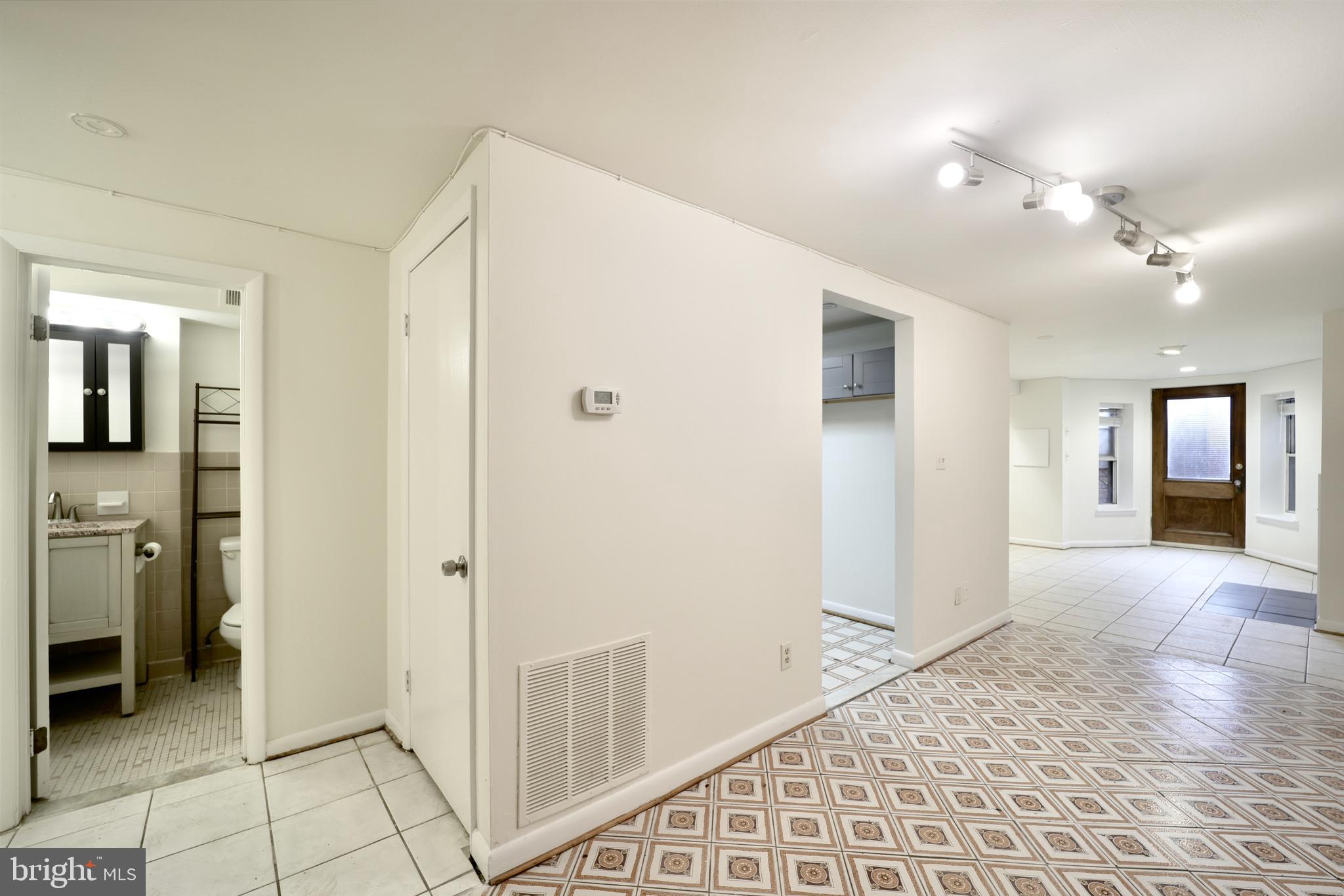1926 15th Street Northwest, Unit 1 Washington, DC 20009 - Photo 6 of 13 a view of a hallway with bathroom and bathroom