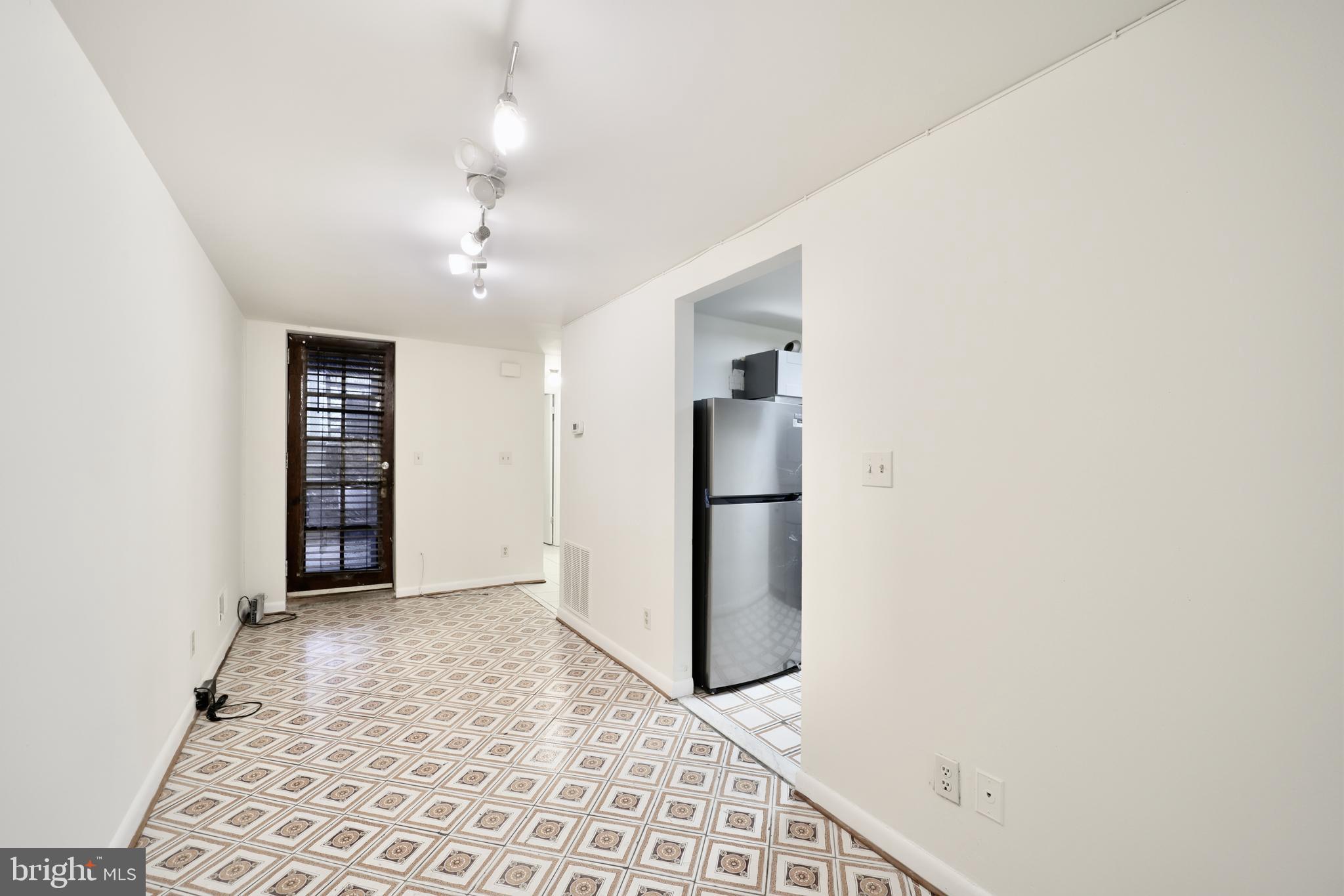 1926 15th Street Northwest, Unit 1 Washington, DC 20009 - Photo 7 of 13 an empty room with windows and closet
