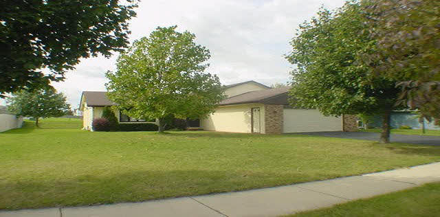 a view of a yard in front of a house