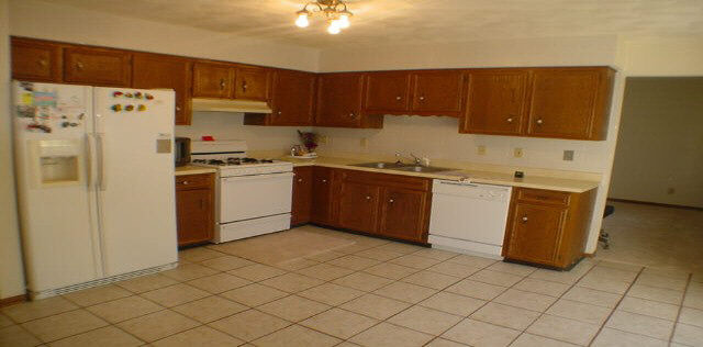 3164 North Trainer Road Rockford, IL 61114 - Photo 4 of 5 a kitchen with stainless steel appliances granite countertop a refrigerator a sink and dishwasher