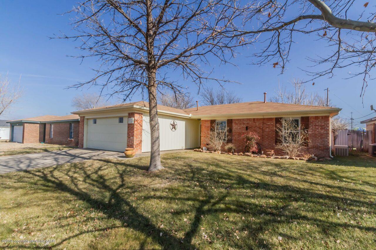 5337 Whitney Lane Amarillo, TX 79110 - Photo 2 of 32 a view of a house with a big yard and large tree