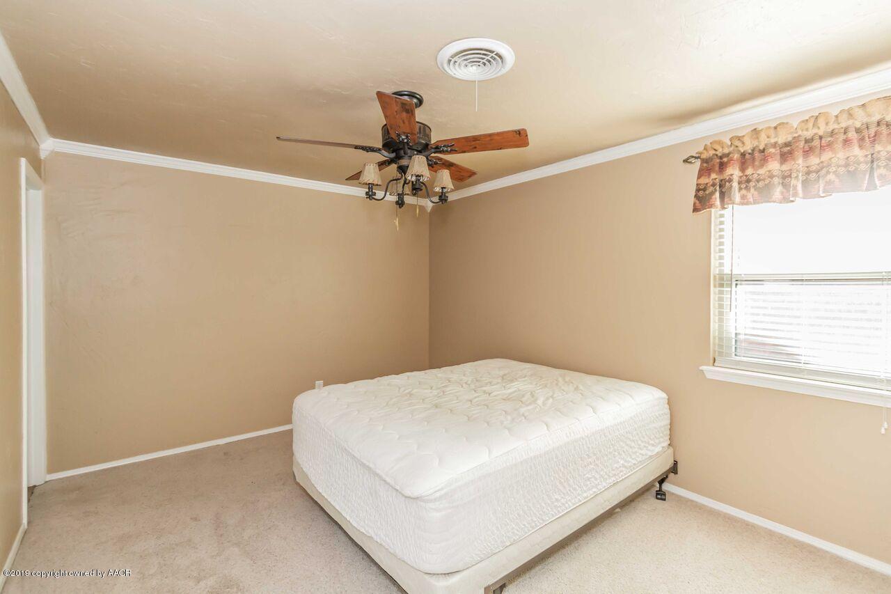 5337 Whitney Lane Amarillo, TX 79110 - Photo 29 of 32 a bedroom with a bed and a window