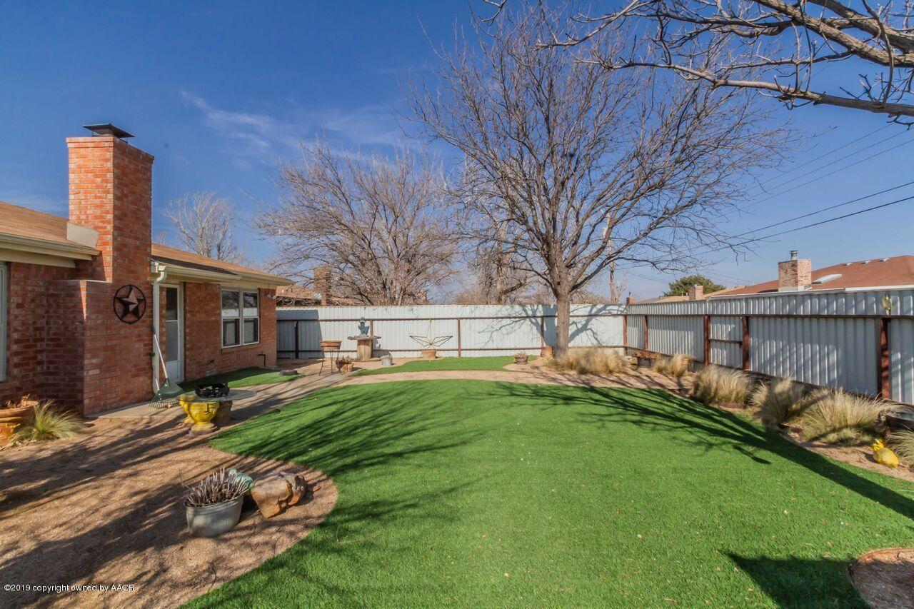 5337 Whitney Lane Amarillo, TX 79110 - Photo 6 of 32 a backyard of a house with barbeque oven and outdoor seating