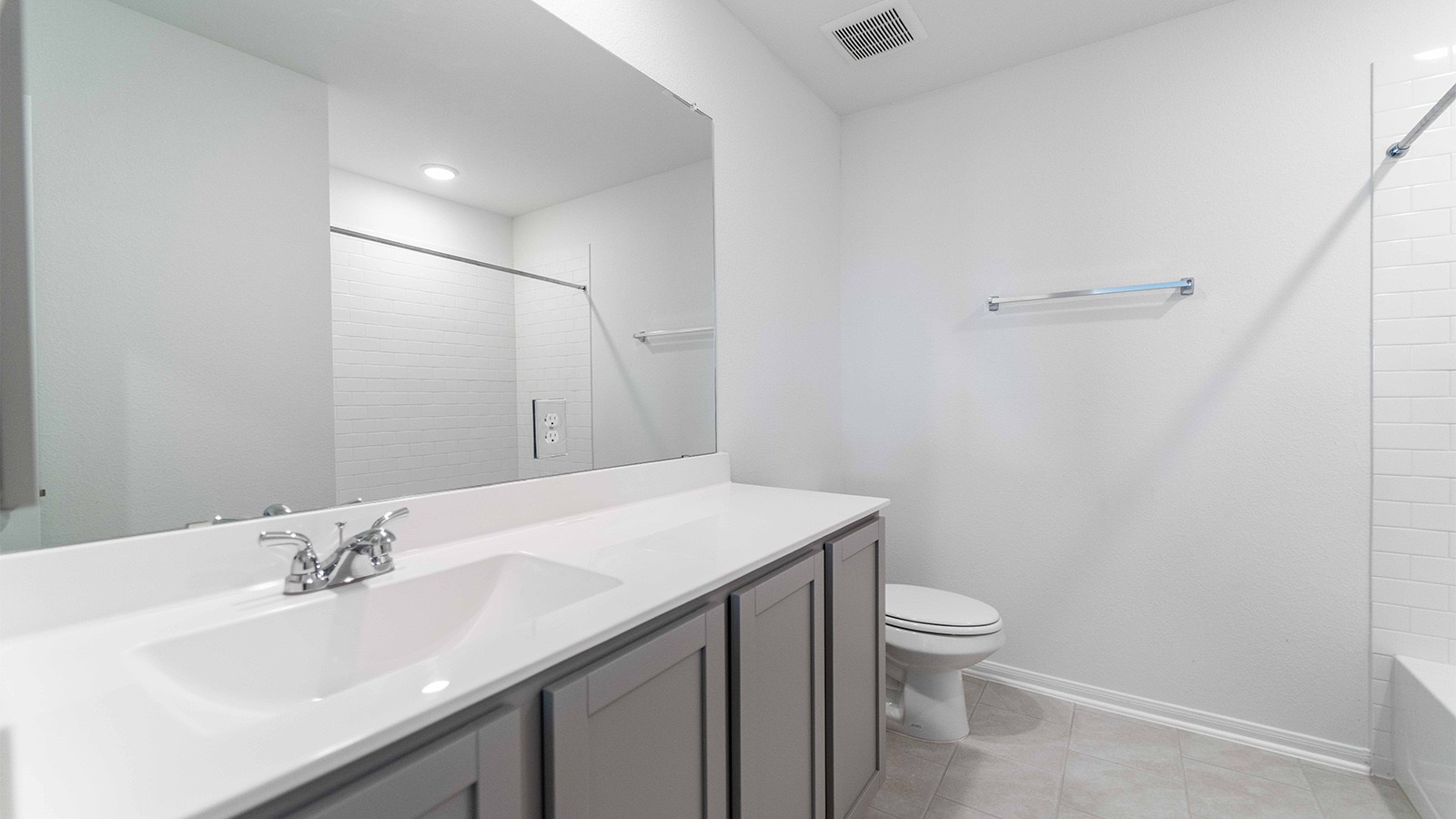 13621 Endless Narrow Lane Elgin, TX 78621 - Photo 14 of 19 a bathroom with a sink a toilet and a mirror