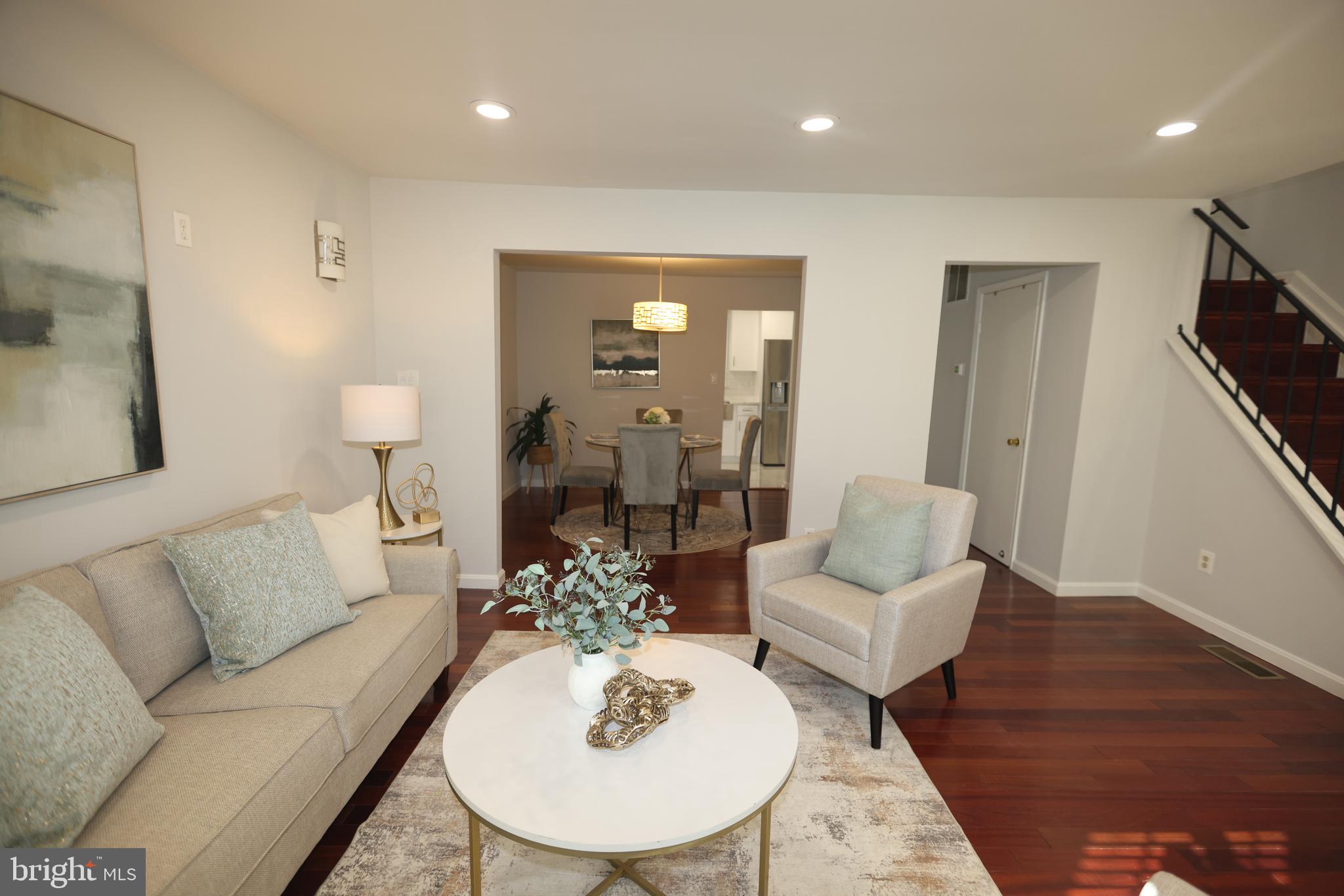 8580 Tyrolean Way Springfield, VA 22153 - Photo 11 of 63 a living room with furniture and wooden floor