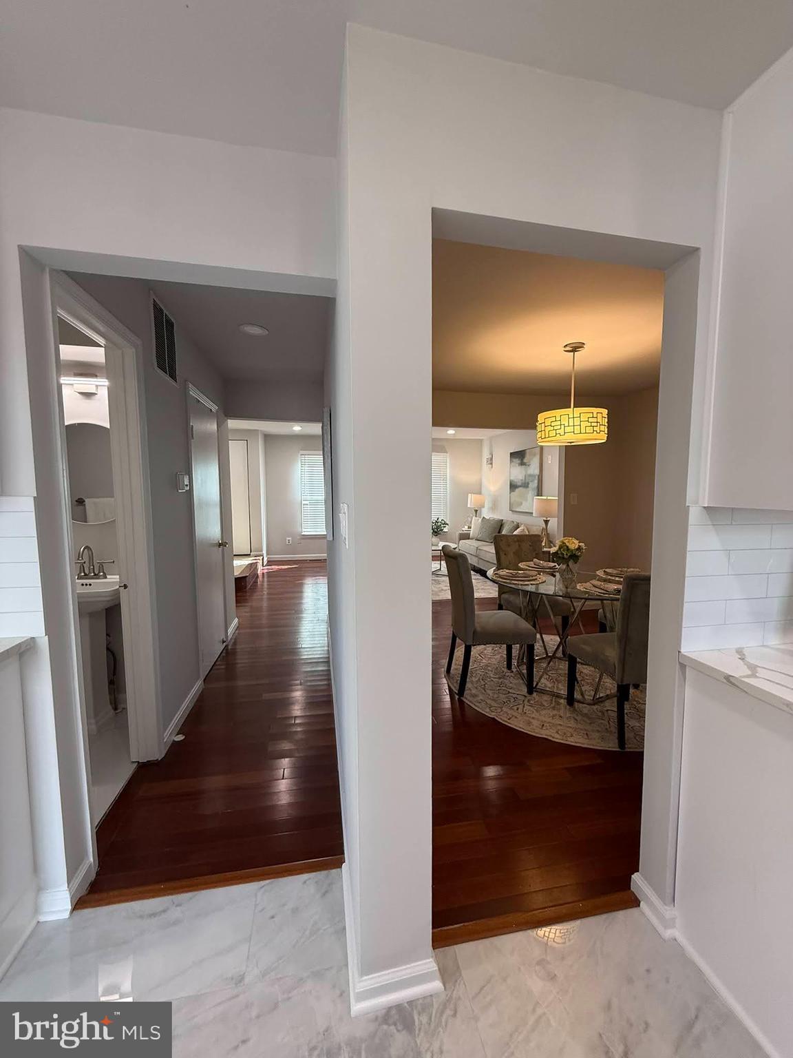 8580 Tyrolean Way Springfield, VA 22153 - Photo 14 of 63 a view of a hallway with livingroom and furniture