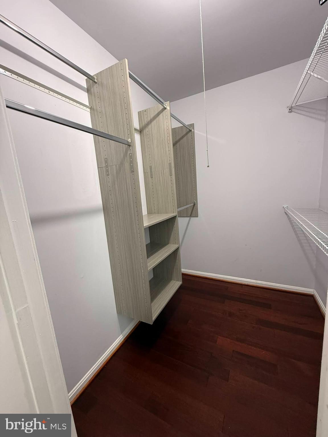 8580 Tyrolean Way Springfield, VA 22153 - Photo 27 of 63 a view of walk in closet with empty racks