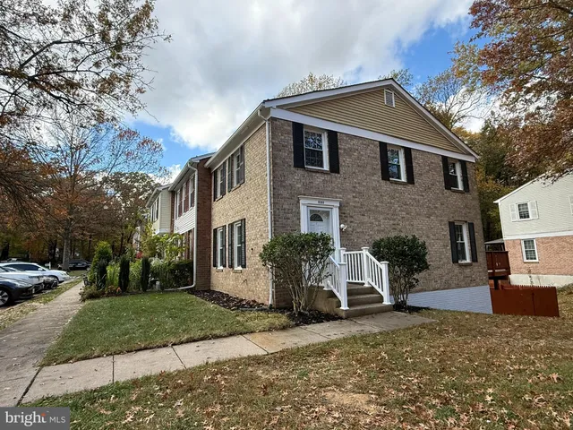 a front view of a house with yard