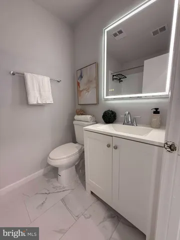 a living room with furniture and a piano