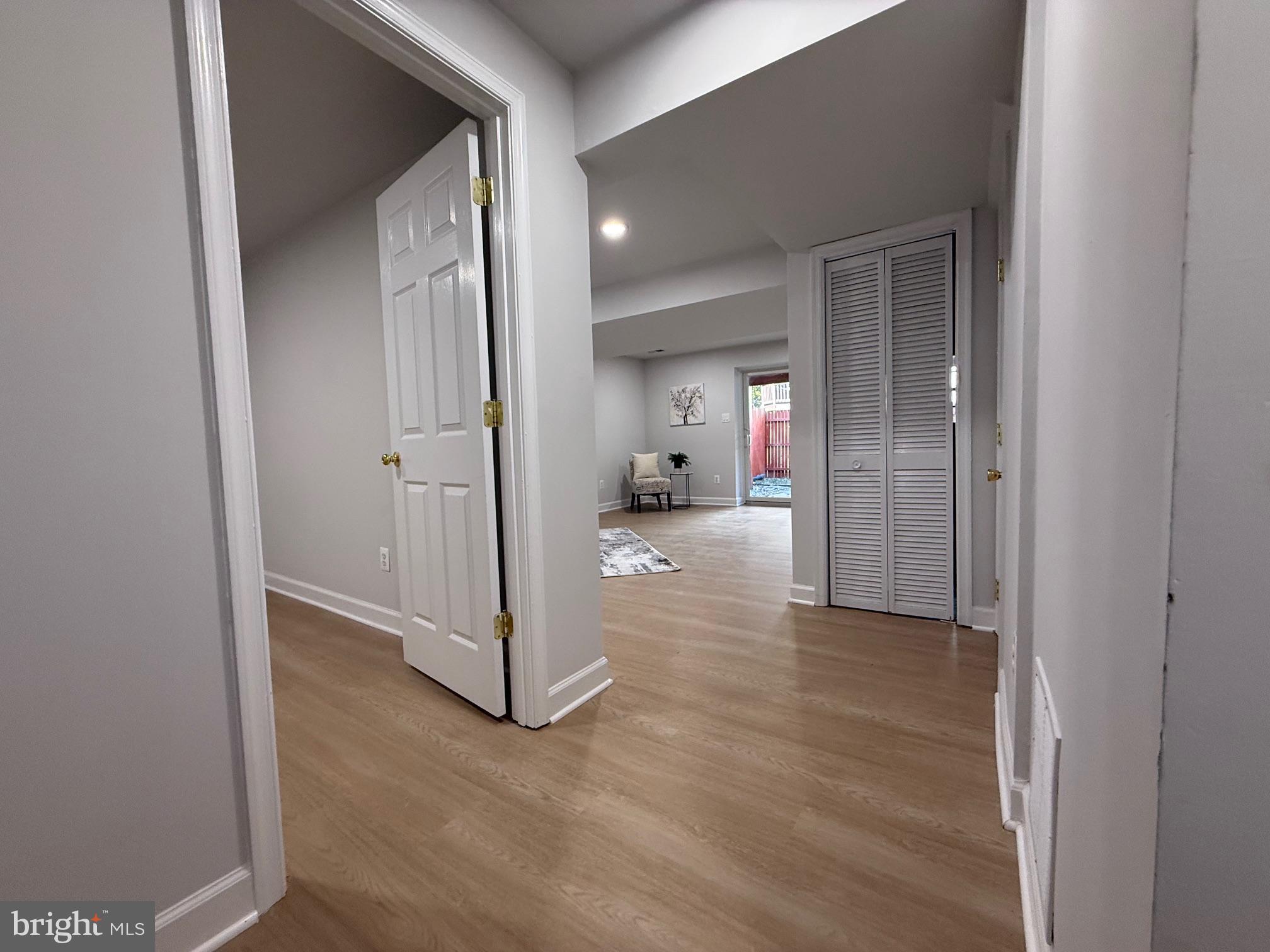 8580 Tyrolean Way Springfield, VA 22153 - Photo 54 of 63 a view of a hallway with wooden floor