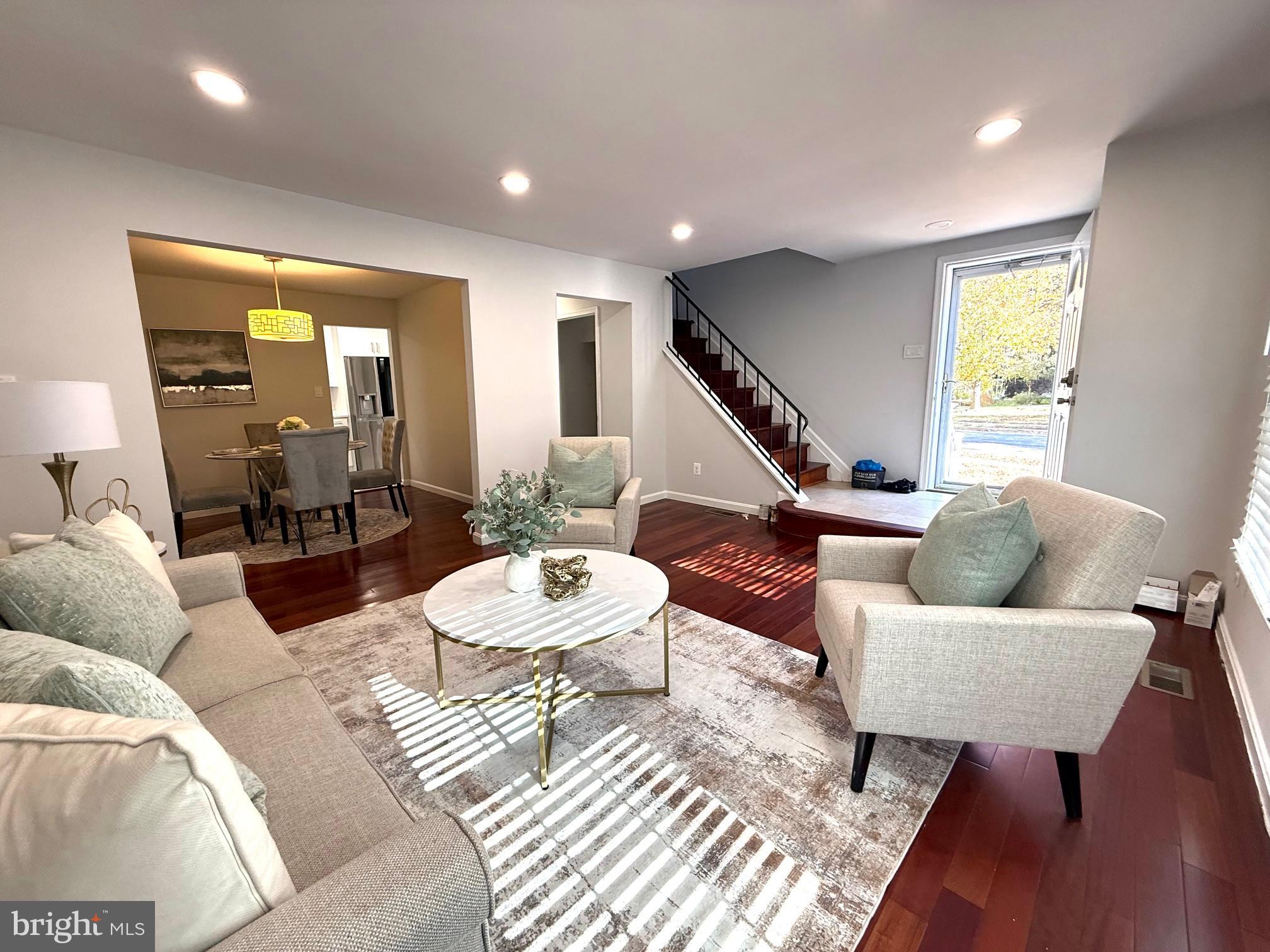 8580 Tyrolean Way Springfield, VA 22153 - Photo 57 of 63 a living room with furniture and a wooden floor
