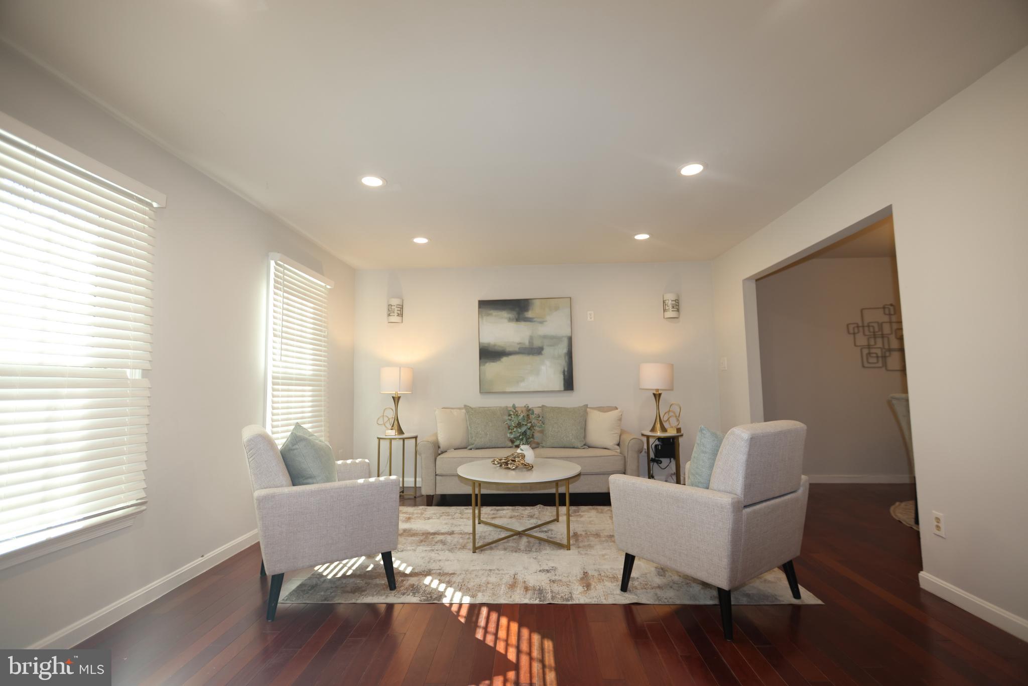 8580 Tyrolean Way Springfield, VA 22153 - Photo 7 of 63 a living room with furniture and a window