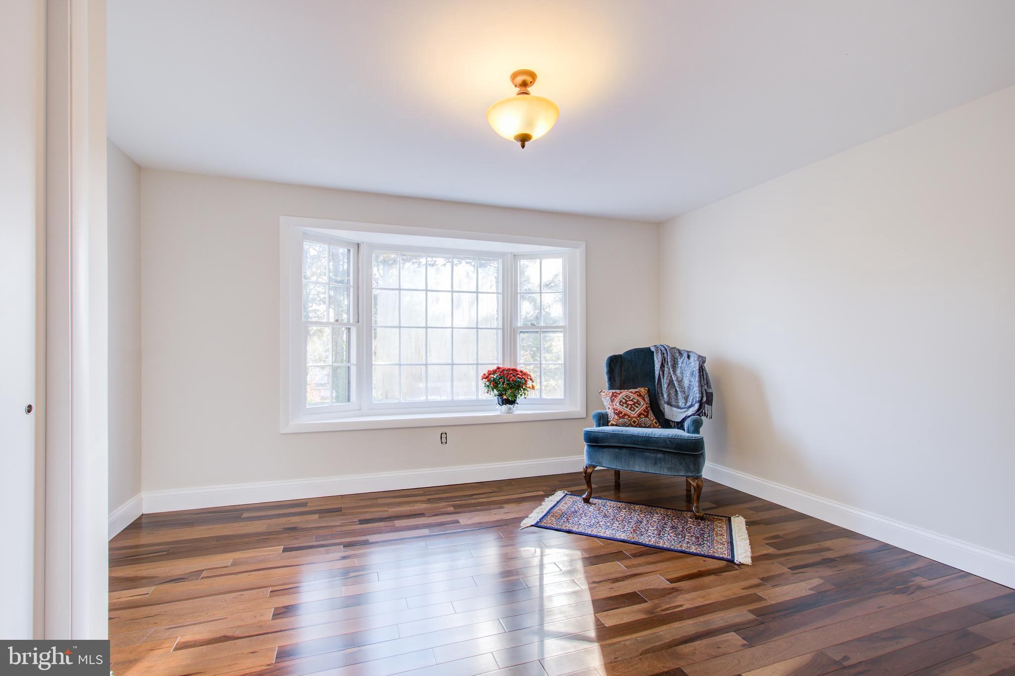 1004 Stirling Road Silver Spring, MD 20901 - Photo 15 of 27 a living room with furniture and a window