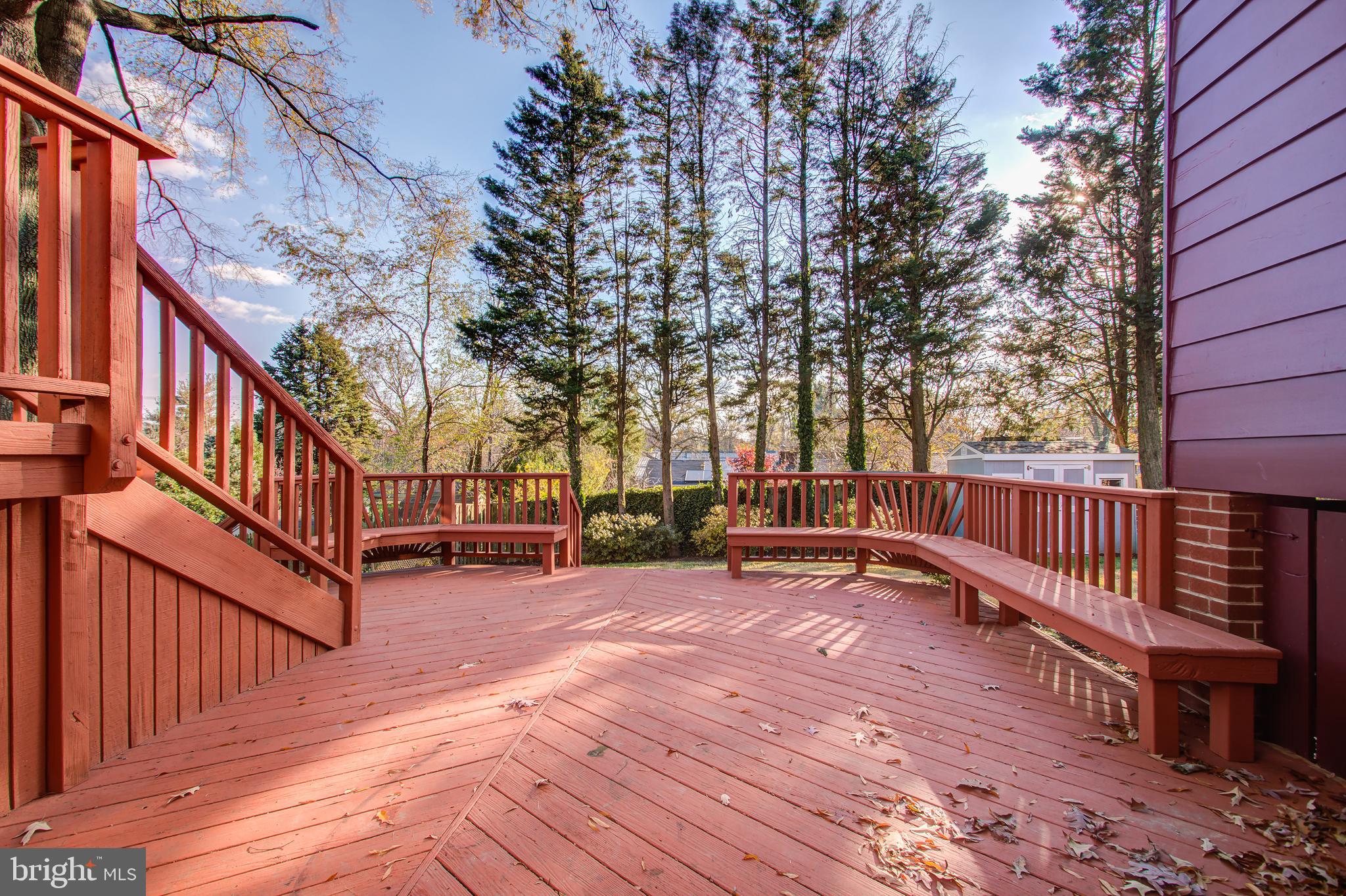 1004 Stirling Road Silver Spring, MD 20901 - Photo 24 of 27 a view of a deck with wooden floor and fence with a bench