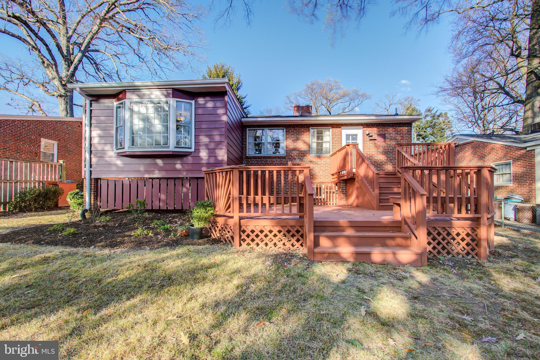 1004 Stirling Road Silver Spring, MD 20901 - Photo 25 of 27 a view of a house with a wooden deck