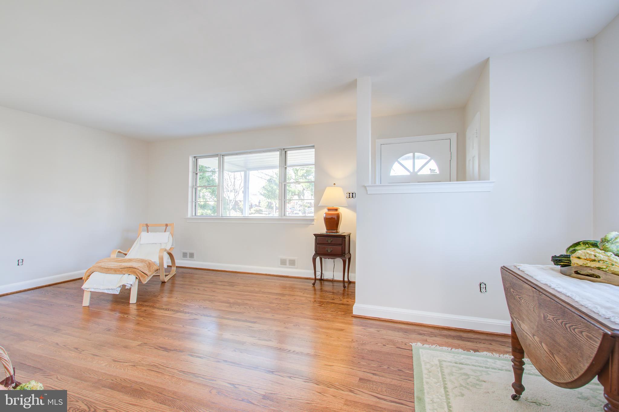 1004 Stirling Road Silver Spring, MD 20901 - Photo 6 of 27 a living room with furniture and a wooden floor