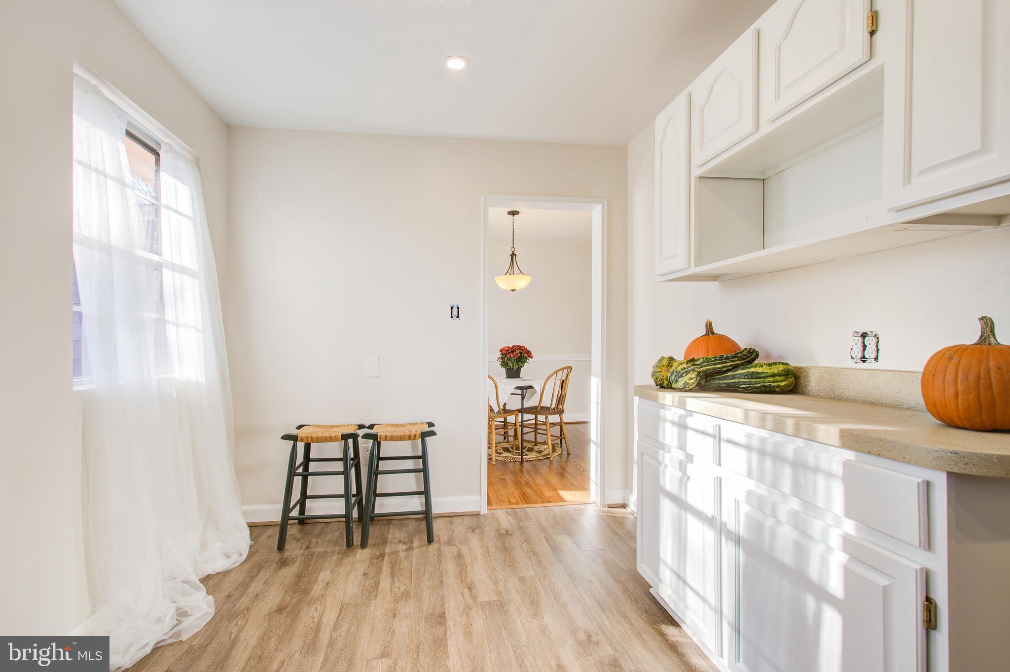 1004 Stirling Road Silver Spring, MD 20901 - Photo 10 of 27 a view of kitchen with furniture and wooden floor