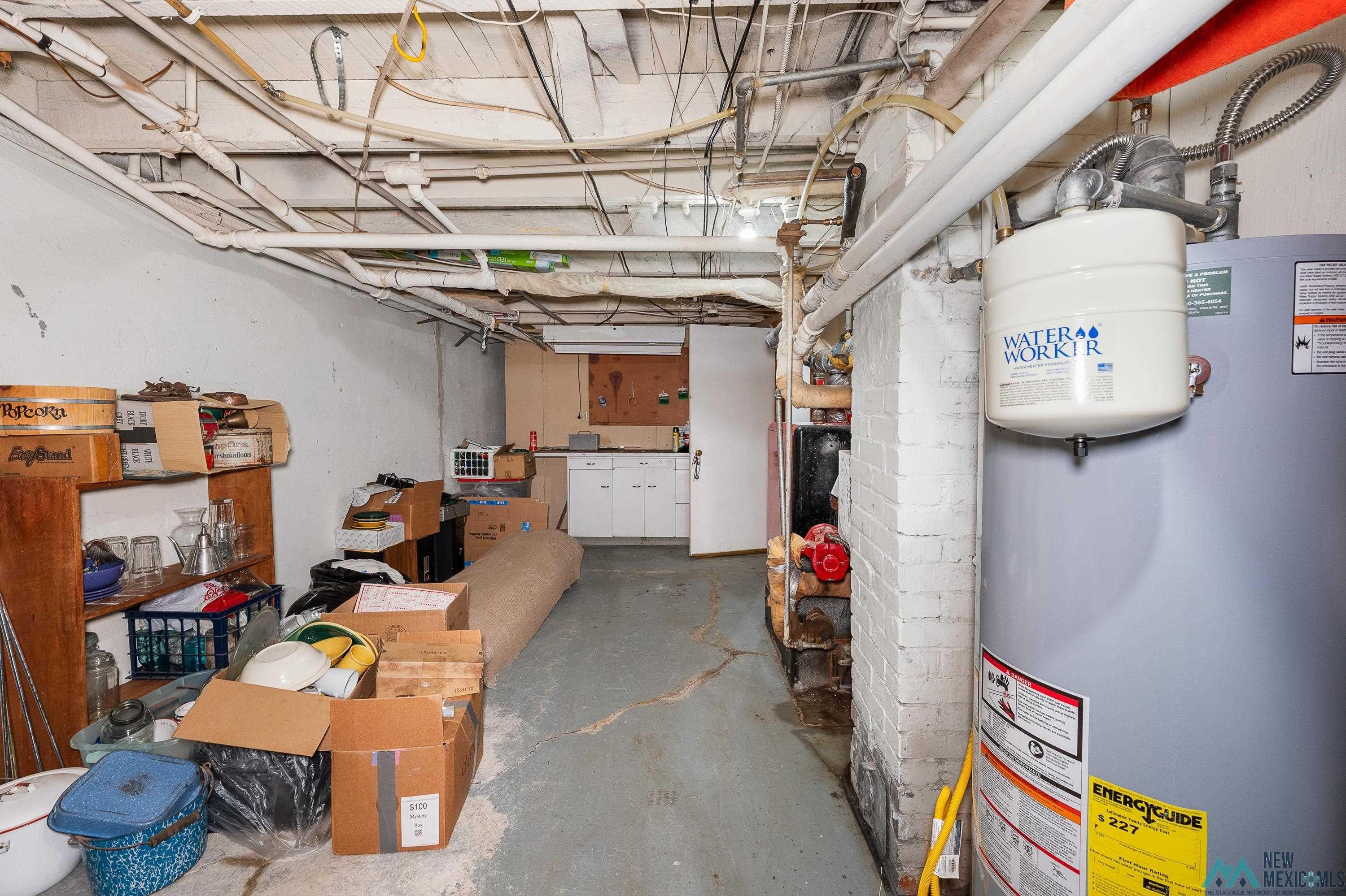 727 South 6th Street Raton, NM 87740 - Photo 29 of 47 Unfinished basement featuring water heater