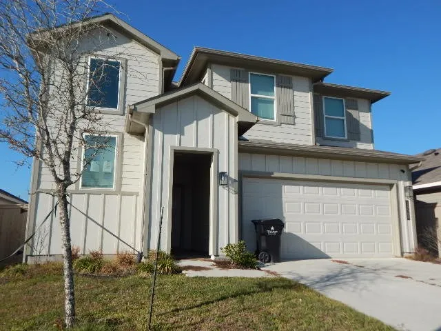 a front view of a house with garage