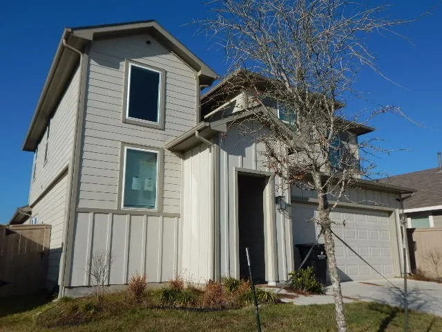 a view of a house with a small yard