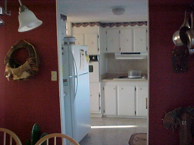 14631 Fisk Road Yakima, WA 98908 - Photo 16 of 18 a kitchen with a refrigerator and cabinets