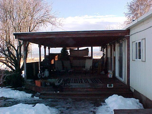 14631 Fisk Road Yakima, WA 98908 - Photo 7 of 18 a view of patio with a table chairs and a potted plant