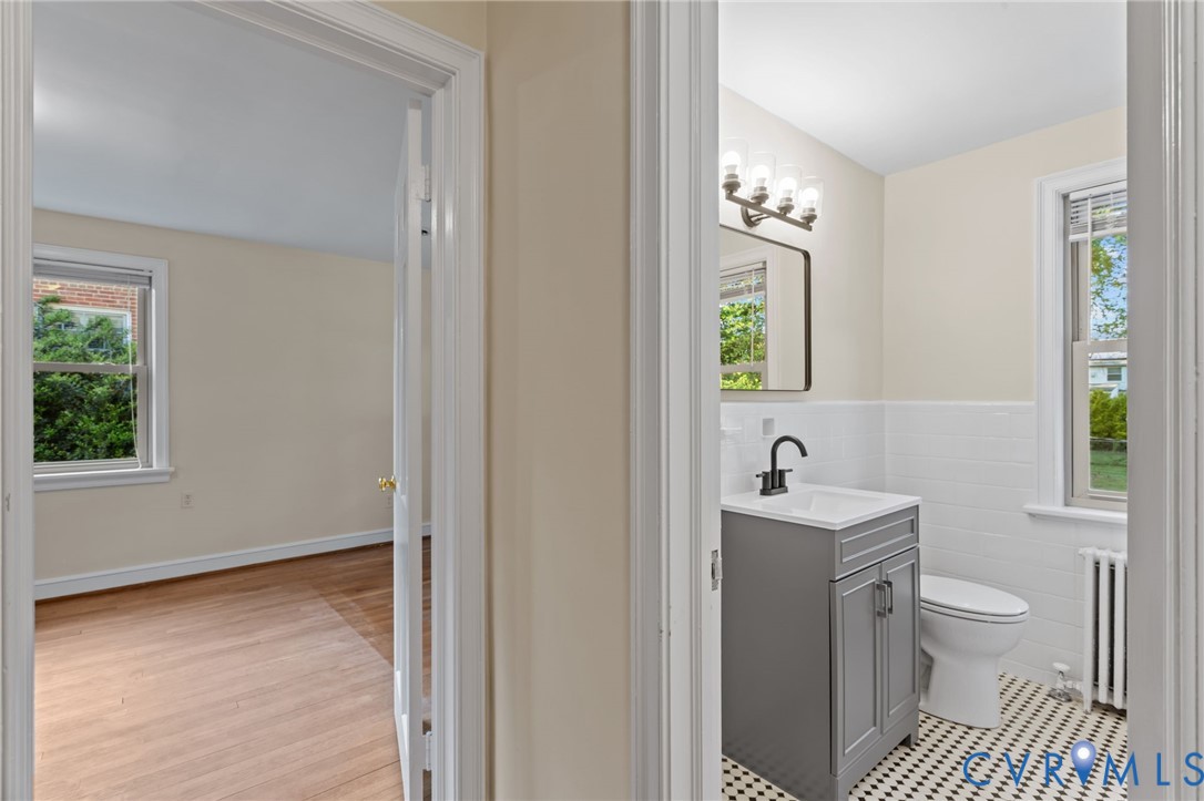4804 Morrison Road Richmond, VA 23230 - Photo 33 of 48 a bathroom with a toilet a sink and a window