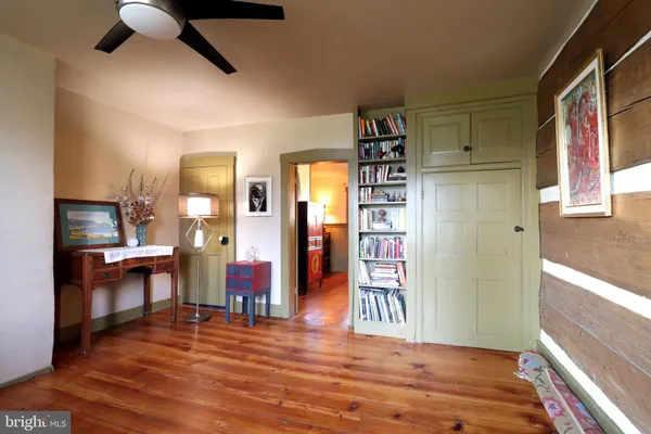 a view of a livingroom kitchen and dining room with wooden floor