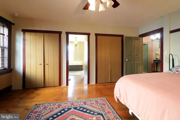 a bathroom with a mirror a sink and glass door