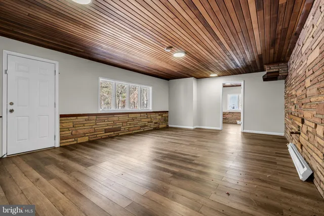 a view of room with wooden floor