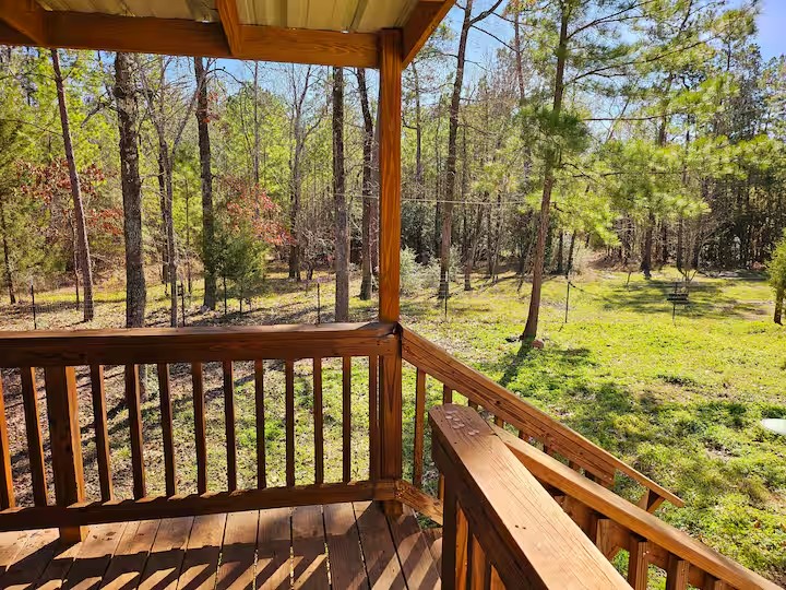 105 Saddle Surrey Road Coldspring, TX 77331 - Photo 6 of 48 a view of swimming pool from a balcony