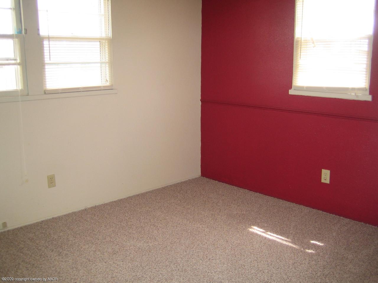 5019 Bowie Street Amarillo, TX 79110 - Photo 10 of 10 an empty room with a window