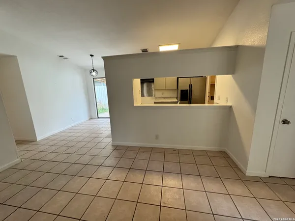 a view of a livingroom with an empty space and a sink