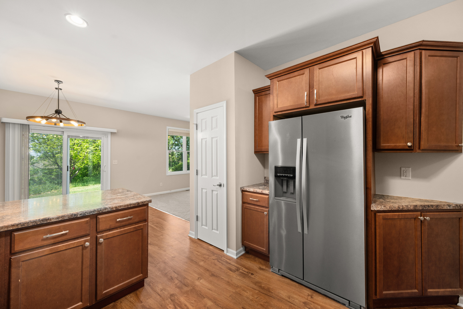 3705 Green Tree Lane DeKalb, IL 60115 - Photo 10 of 31 a kitchen with stainless steel appliances granite countertop a refrigerator and a sink