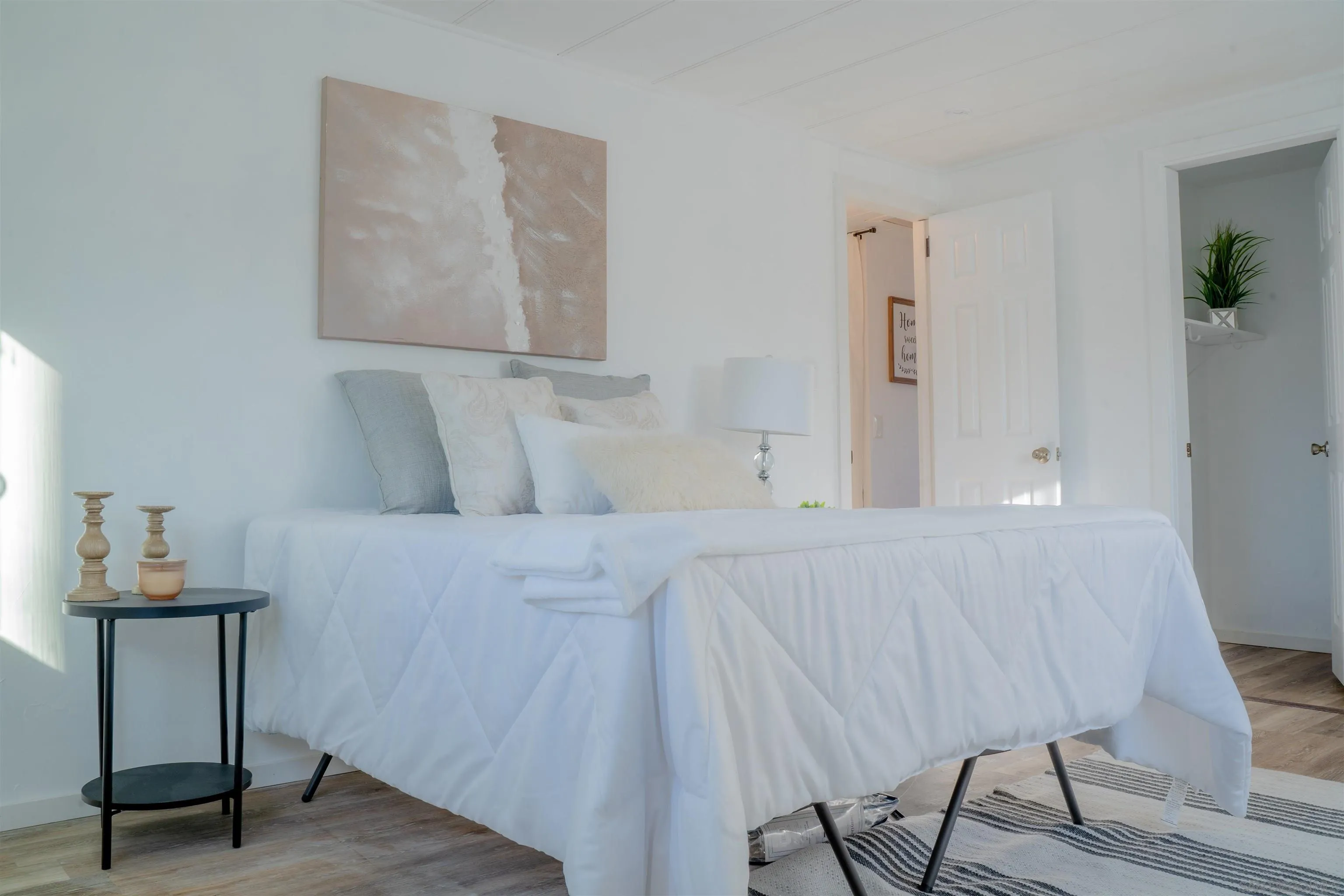 3221 Bancroft Drive, Unit SPC 1 Spring Valley, CA 91977 - Photo 11 of 22 a bedroom with a bed and a lamp on table